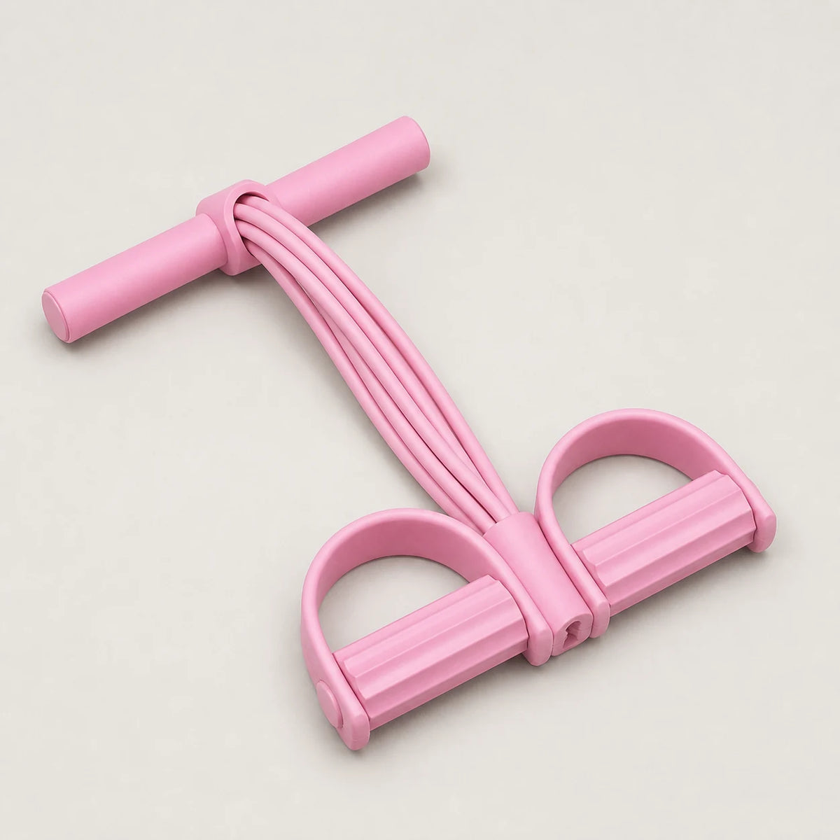 Pink six tube resistance pedal trainer for home workouts